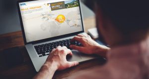 Photograph of a laptop showing a screen from the Sales Marathon campaign screen. The campaign was created by Born + Raised for SITA and allowed sales staff to aim for track their sales progress towards a target of a holiday to Beijing.