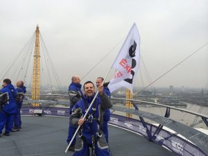 A photograph from the Up at the 02 campaign by Born + Raised for Arco. The photgraph shows Managing Director Andy Weir on the roof of the London O2.