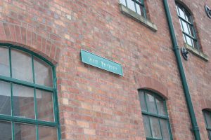 The Grain Warehouse Sign outside Born+Raised offices