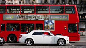 A visual from the Love Your Space campaign by Born + Raised for Express Bi-folding Doors. The visuals shows a T-side bus advertisement on the side of a red bus.