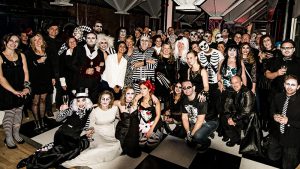 A group photograph taken at the Born + Raised Halloween party in 2015.