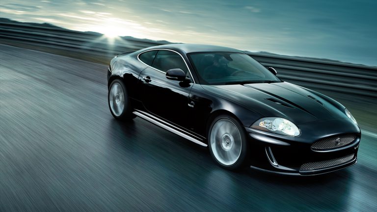 A photograph of a Jaguar car used in the Car Care Plan materials designed by Born + Raised.