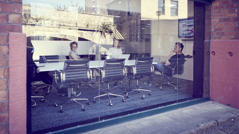 The Born + Raised team photographed during a meeting in their Sheffield office, The Grain Warehouse. Photographed are Bew Knox, Creative Director, Charlotte Hill, Account Direct and Carol-Anne Ward.