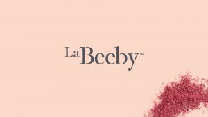 LeBeeby logo on pink background. Photographed and designed by Born + Raised.