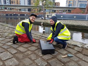 Sam Lightfinch, Copywriter and Marianne MacKenzie, Account Director, helping to tidy the grounds around Born and Raised