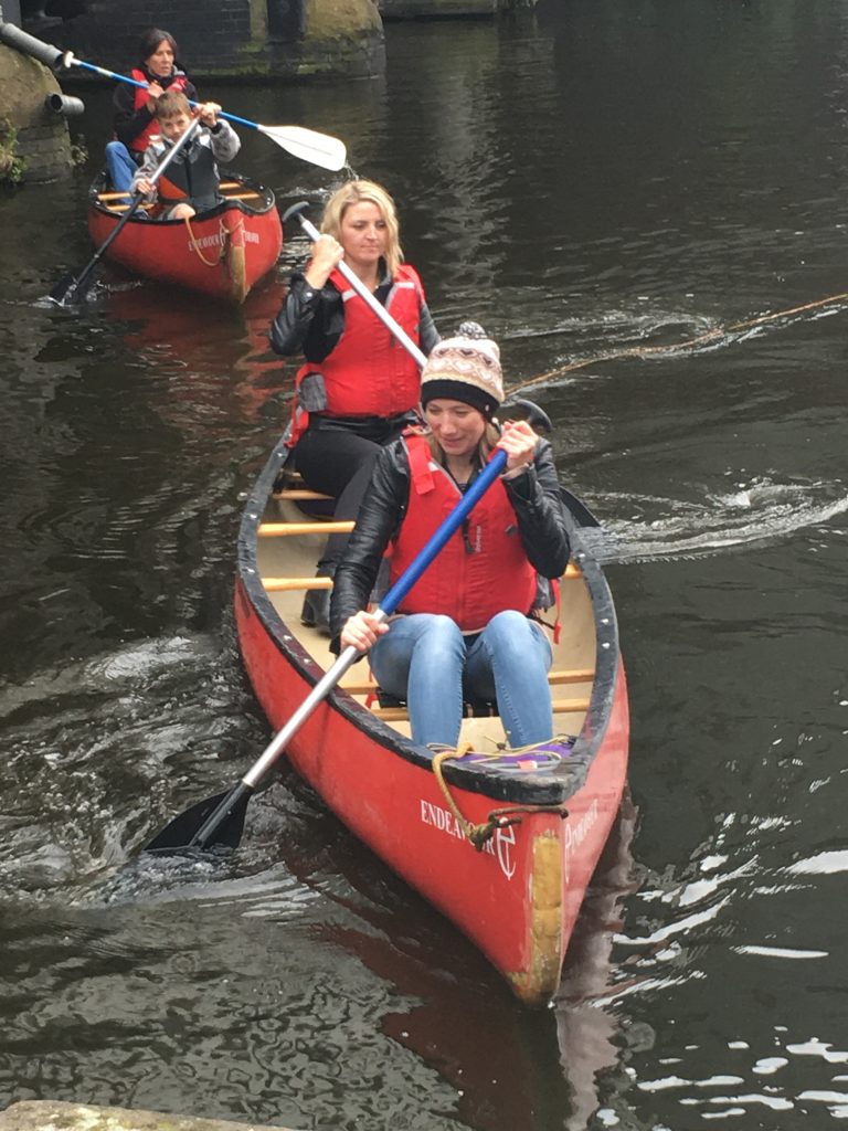 The Born and Raised team rowing boats