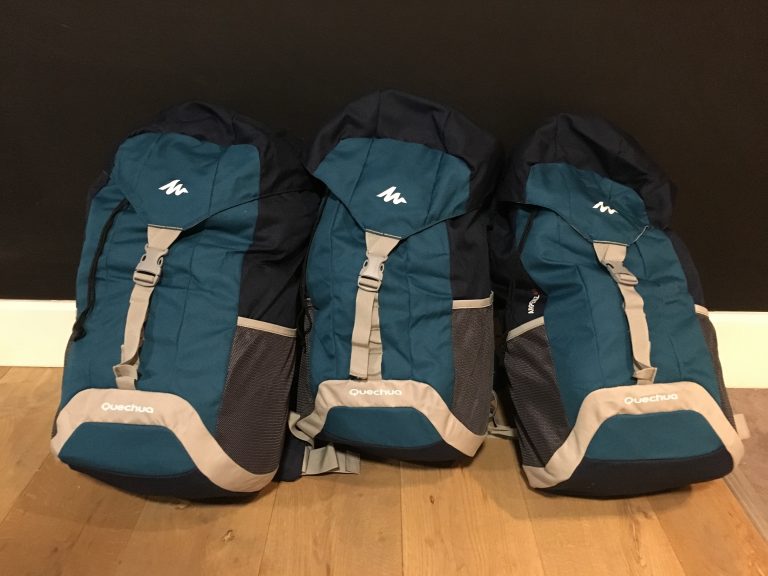 Three large backpacks in a row