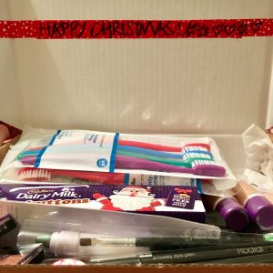An assortment of toiletry products in a christmas box
