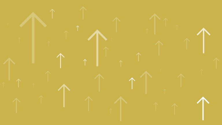 Top of the blogs banner- white arrows pointing upwards on a gold background