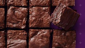 Brownies cut into squares with the Born and Raised + in the background