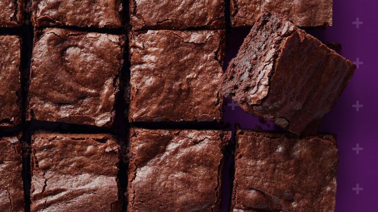 Brownies cut into squares with the Born and Raised + in the background
