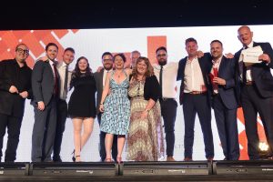 Photo of the Born and Raised team accepting the Prolific North award