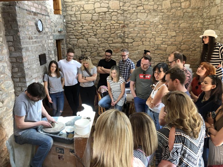 The Born and Raised team, watching a potter at work in Chester