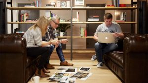 Yvette Weir, Head of Design, Steve Doyle, Head of Copy and Bew Knox, Head of Design, all of Born and Raised, brainstorming on the sofas