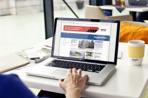 A laptop featuring a campaign banner made by Born and Raised