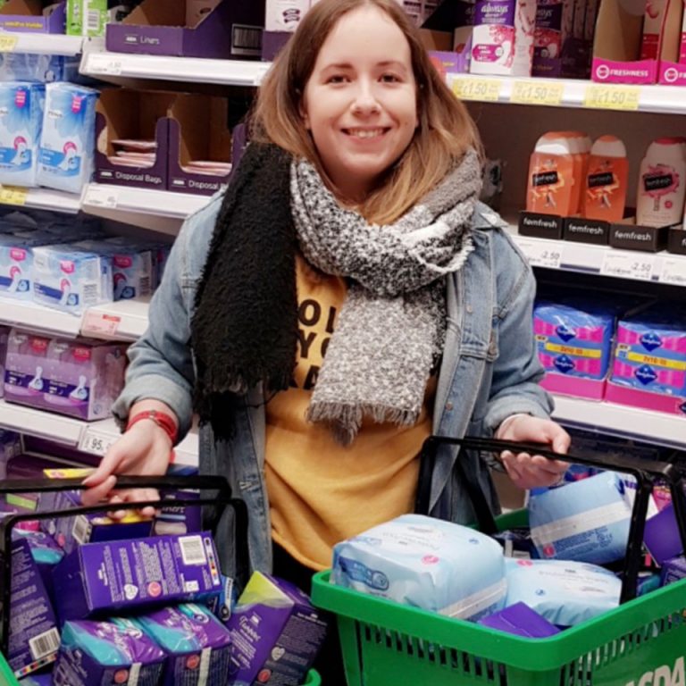 Megan Cliffe, Marketing and Business Development Executive at Born and Raised holding the products she bought for the Cardless Christmas project
