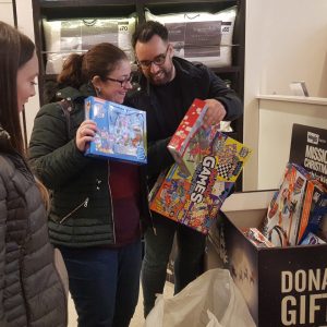 Harriet Aisthorpe. Helen Stavri and Abbas Arezoo from Born and Raised, donating toys bought